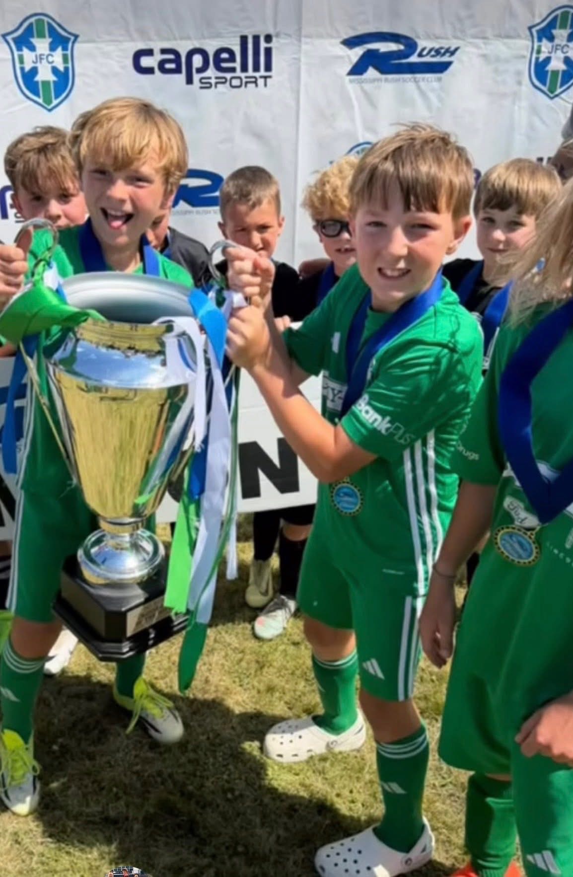 Players celebrating with the championship cup