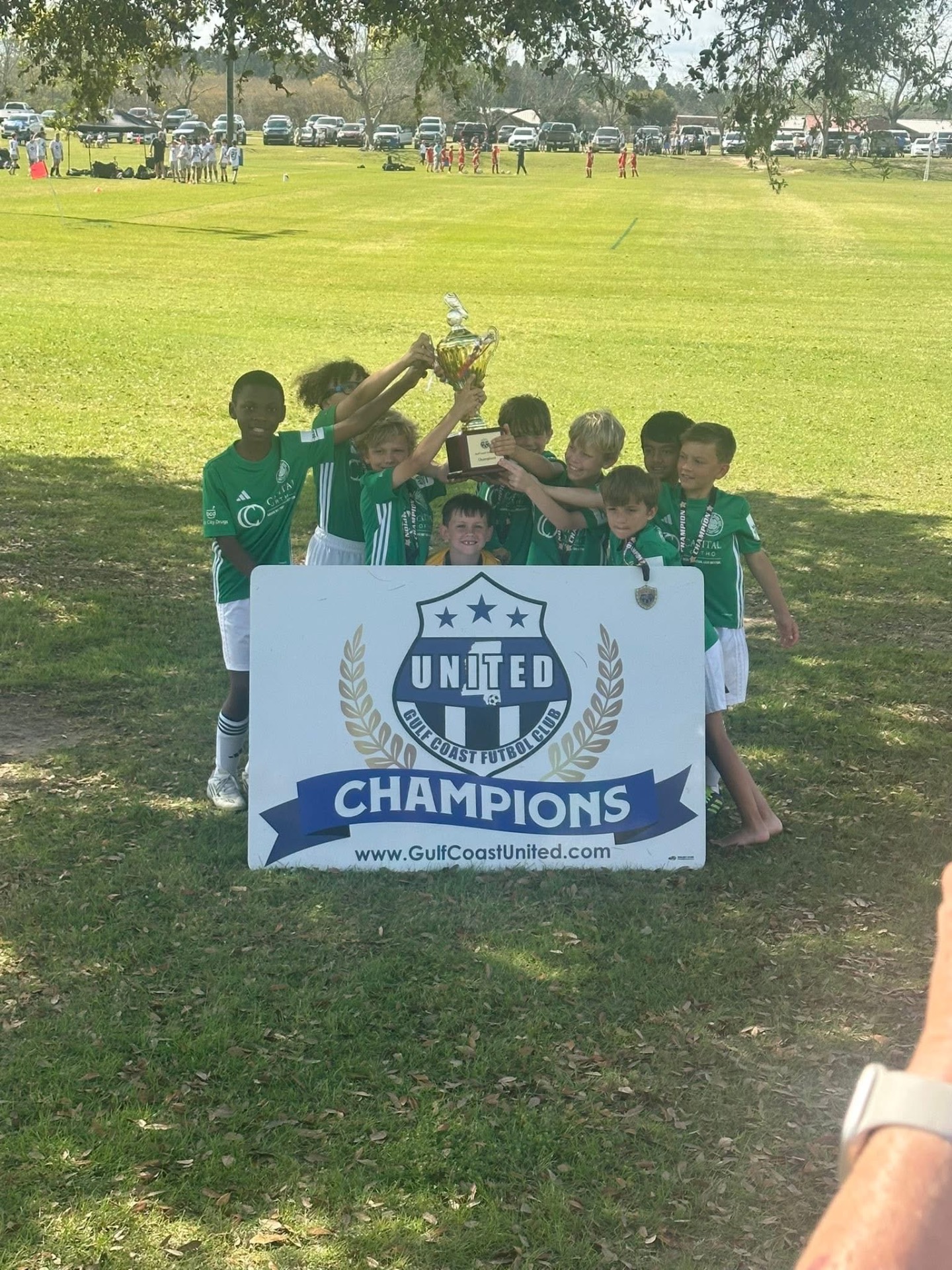 Team lifting the championship trophy