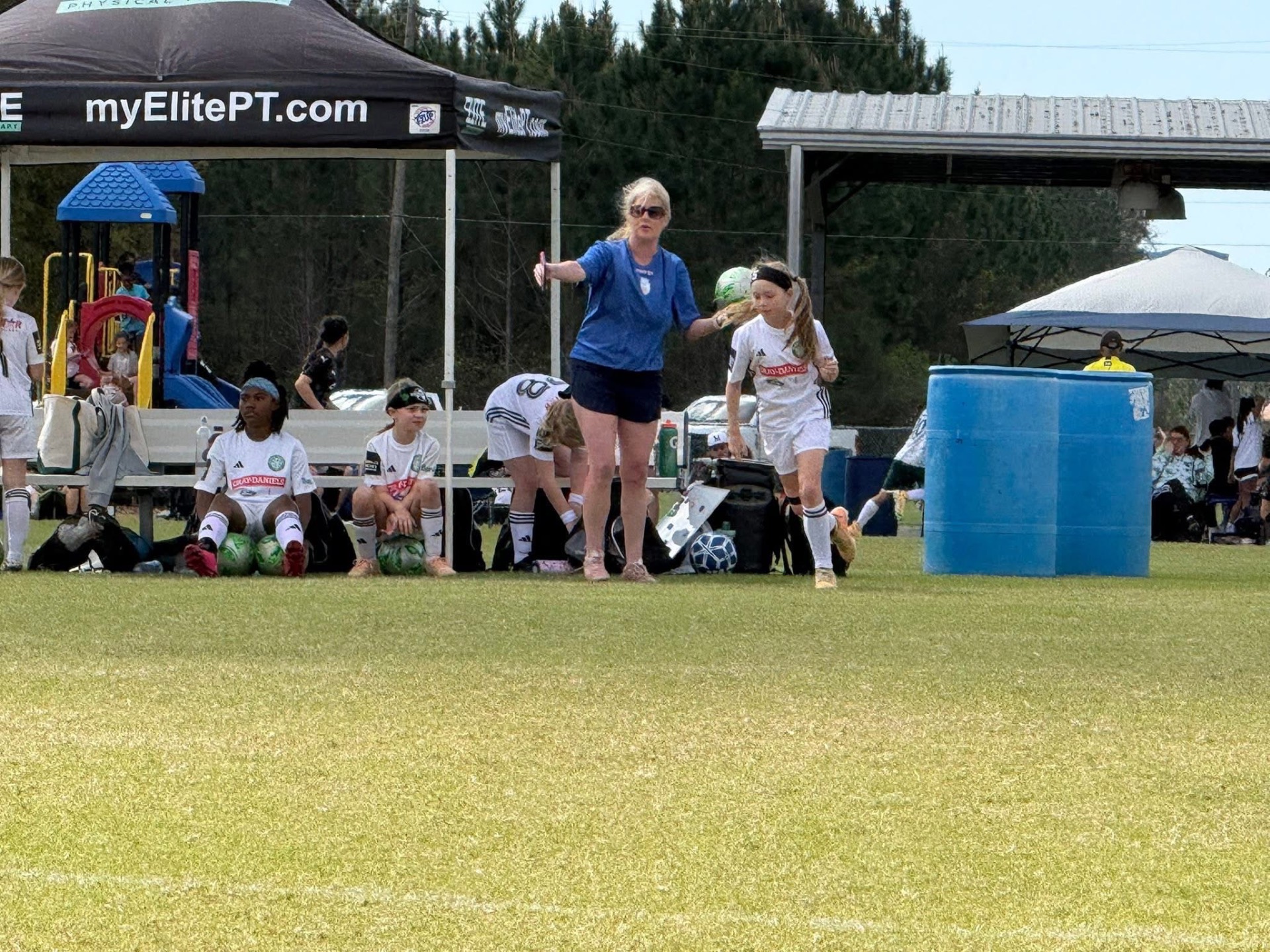 Coach sending a GFC girls player onto the field